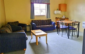 comfortable sofa and dining table chairs in units